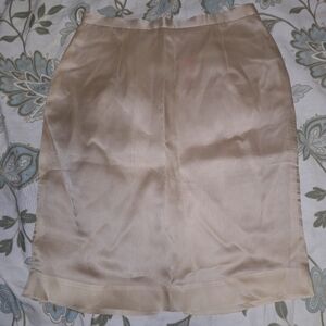An Against Gravitee 100% Silk pencil skirt in a size 6. Pre-loved in great shape